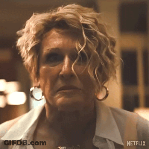 A Close Up Of A Woman 'S Face With A Netflix Logo On The Bottom GIF