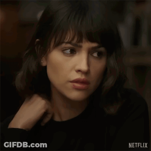 A Close Up Of A Woman 'S Face With A Netflix Logo On The Bottom Right . GIF