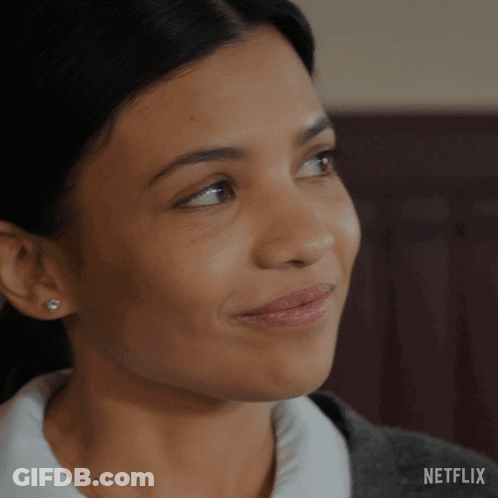 A Close Up Of A Woman 'S Face With A Netflix Logo On The Bottom GIF