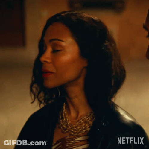 A Close Up Of A Woman 'S Face With A Netflix Logo On The Bottom GIF