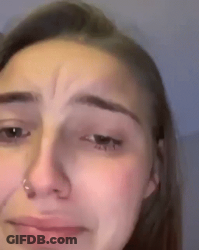 A Close Up Of A Woman 'S Face With A Nose Ring On It . GIF