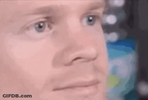 A Close Up Of A Woman 'S Face With A Pink Background And A Pink Lip Gloss . GIF