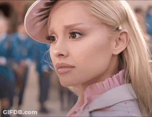 A Close Up Of A Woman 'S Face With A Pink Hat GIF