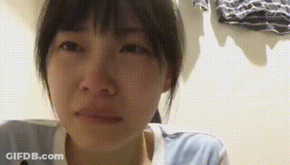 A Close Up Of A Woman 'S Face With A Polka Dot Pattern . GIF