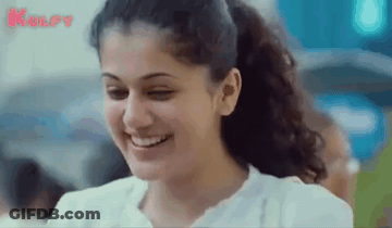 A Close Up Of A Woman 'S Face With A Ponytail And Smiling . GIF