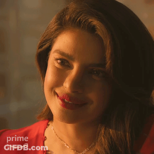 A Close Up Of A Woman 'S Face With A Prime Logo Behind Her GIF