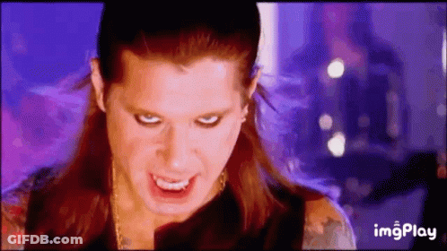 A Close Up Of A Woman 'S Face With A Purple Background And The Words Imgplay On The Bottom . GIF