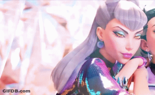 A Close Up Of A Woman 'S Face With A Purple Dress On GIF