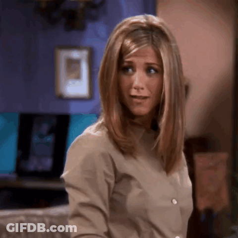 A Close Up Of A Woman 'S Face With A Purple Wall In The Background GIF
