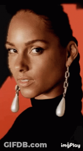 A Close Up Of A Woman 'S Face With A Red Background And The Word Imgplay Below It GIF