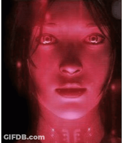 A Close Up Of A Woman 'S Face With A Red Light Coming Out Of Her Eyes GIF