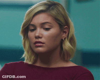 A Close Up Of A Woman 'S Face With A Red Shirt On GIF