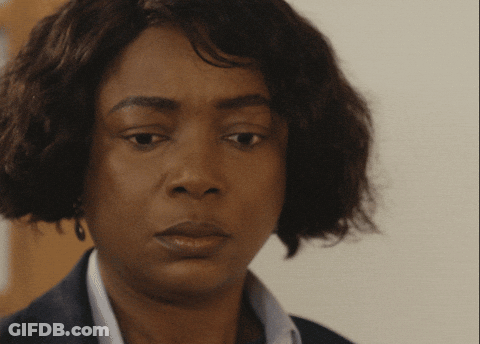 A Close Up Of A Woman 'S Face With A Sad Look On Her Face GIF