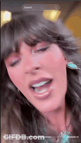 A Close Up Of A Woman 'S Face With A Search Bar At The Bottom GIF