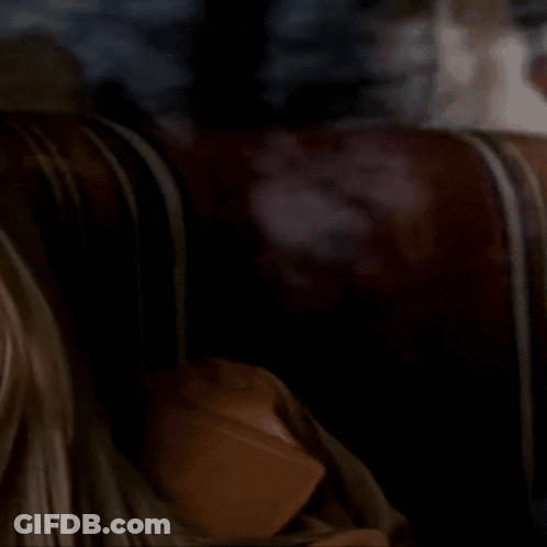 A Close Up Of A Woman 'S Face With A Serious Expression GIF