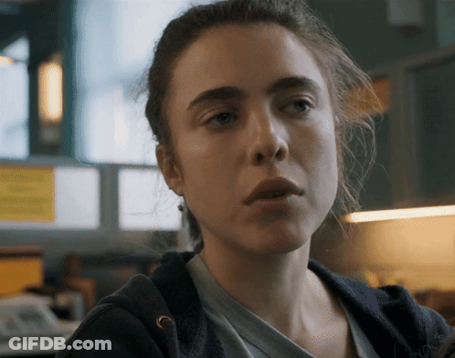 A Close Up Of A Woman 'S Face With A Serious Expression GIF