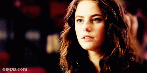 A Close Up Of A Woman 'S Face With A Serious Expression GIF