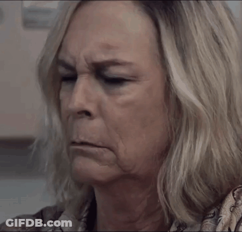 A Close Up Of A Woman 'S Face With A Serious Expression GIF