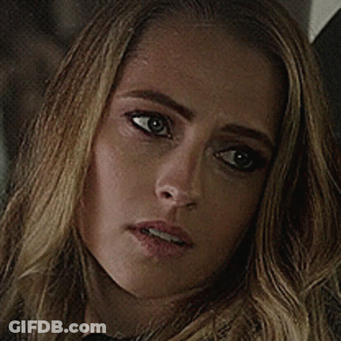 A Close Up Of A Woman 'S Face With A Serious Expression GIF