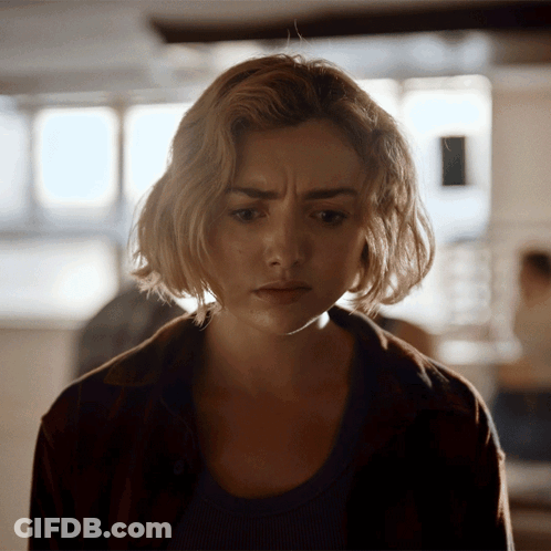 A Close Up Of A Woman 'S Face With A Serious Expression GIF