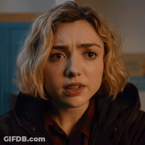 A Close Up Of A Woman 'S Face With A Serious Expression GIF