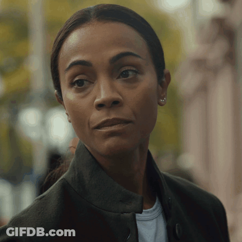 A Close Up Of A Woman 'S Face With A Serious Look GIF
