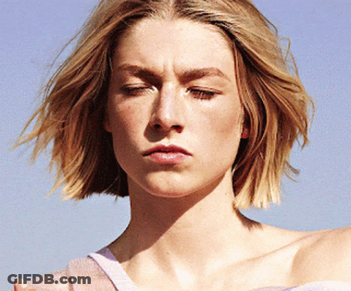 A Close Up Of A Woman 'S Face With A Serious Look On Her Face GIF