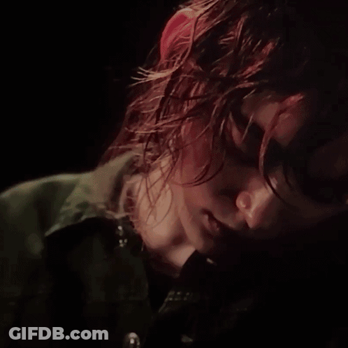 A Close Up Of A Woman 'S Face With A Serious Look On Her Face GIF