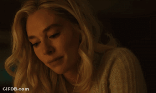 A Close Up Of A Woman 'S Face With A Serious Look On Her Face GIF