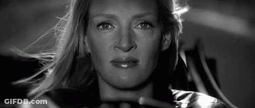 A Close Up Of A Woman 'S Face With A Serious Look On Her Face GIF
