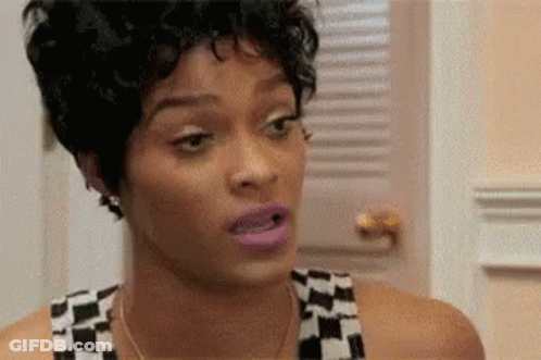 A Close Up Of A Woman 'S Face With A Shocked Look On Her Face . GIF