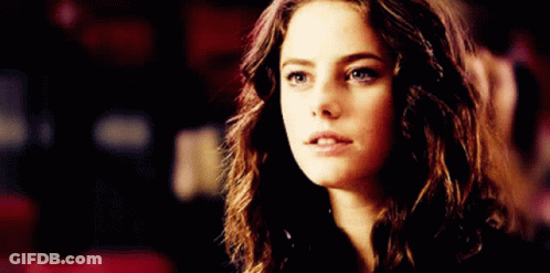 A Close Up Of A Woman 'S Face With A Shocked Look On Her Face GIF