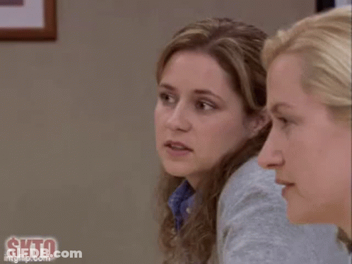 A Close Up Of A Woman 'S Face With A Slight Smile On Her Face . GIF