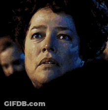 A Close Up Of A Woman 'S Face With A Smile GIF