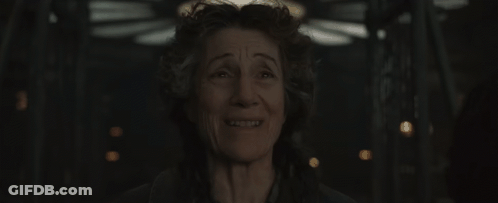 A Close Up Of A Woman 'S Face With A Smile On Her Face . GIF