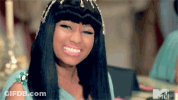 A Close Up Of A Woman 'S Face With A Smile On Her Face GIF