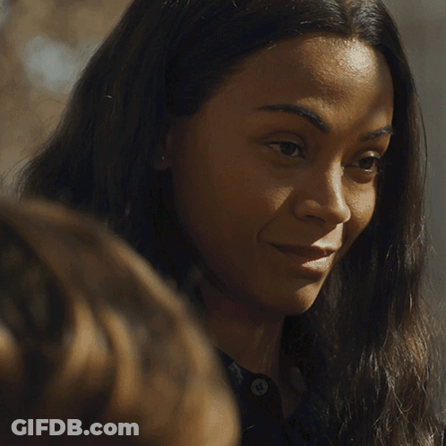 A Close Up Of A Woman 'S Face With A Smile On Her Face GIF
