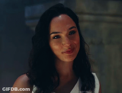 A Close Up Of A Woman 'S Face With A Smile On Her Face GIF