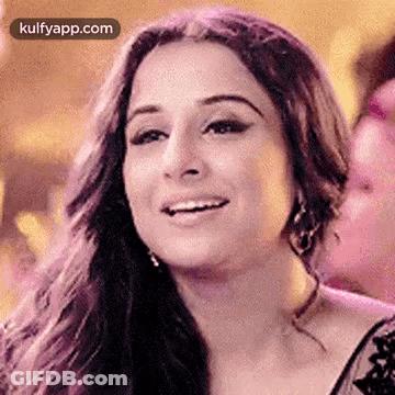 A Close Up Of A Woman 'S Face With A Smile On It . GIF