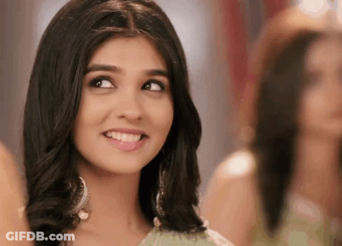 A Close Up Of A Woman 'S Face With A Smile On It GIF