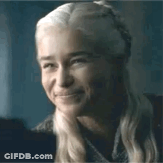 A Close Up Of A Woman 'S Face With A Smile On It . GIF