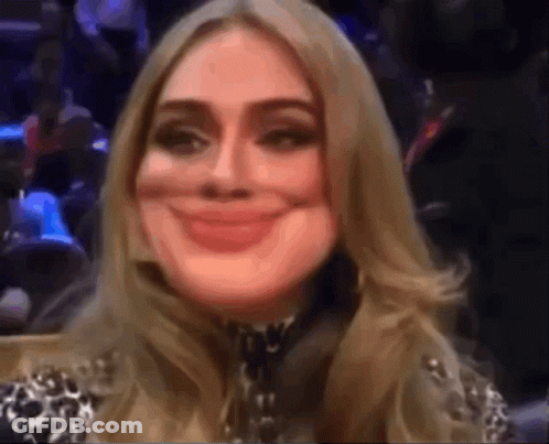 A Close Up Of A Woman 'S Face With A Smile On It GIF