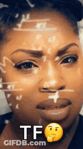 A Close Up Of A Woman 'S Face With A Smiley Face And The Words Tf Written On It GIF
