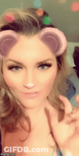 A Close Up Of A Woman 'S Face With A Snapchat Filter On It GIF