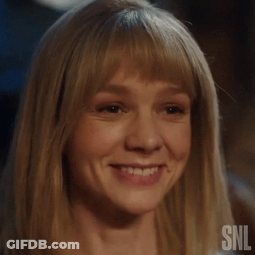 A Close Up Of A Woman 'S Face With A Snl Logo On The Bottom GIF