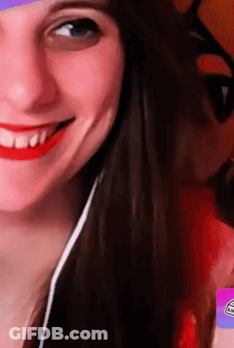 A Close Up Of A Woman 'S Face With A Sticker That Says An GIF