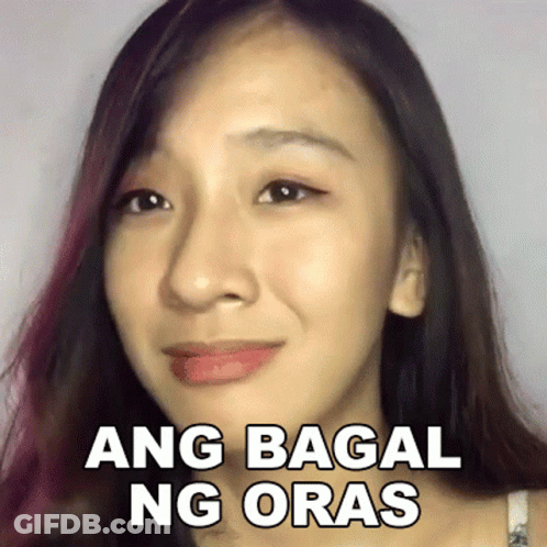 A Close Up Of A Woman 'S Face With A Sticker That Says Ang Bagai Ng Oras . GIF