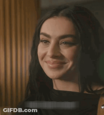 A Close Up Of A Woman 'S Face With A Sticker That Says ' I 'M Sorry ' On It GIF