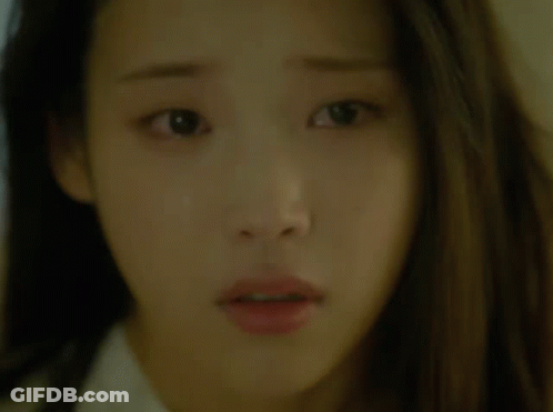 A Close Up Of A Woman 'S Face With A Surprised Expression GIF
