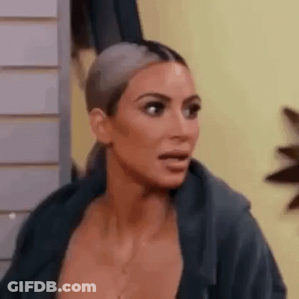 A Close Up Of A Woman 'S Face With A Surprised Expression . GIF